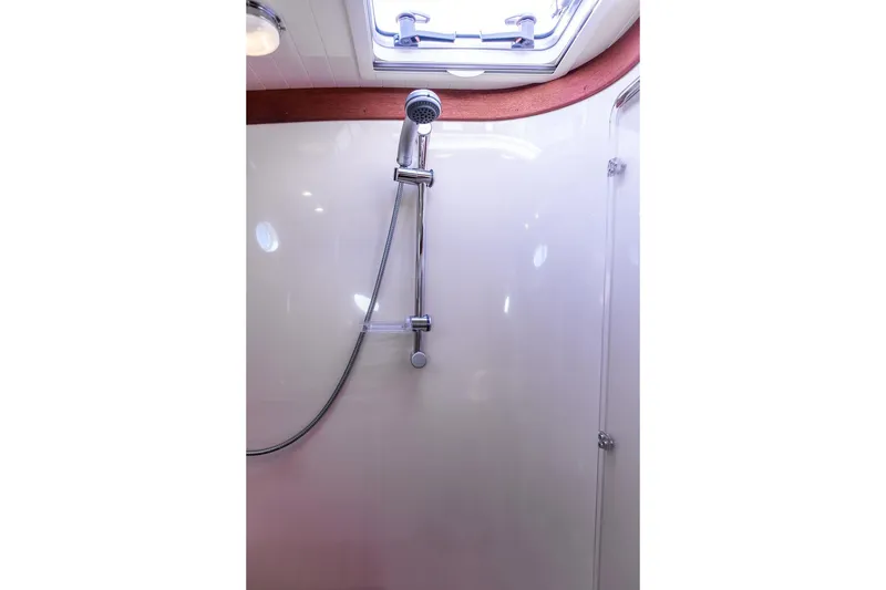 Slide: The Image of Shower area in 2007 Hinckley Talaria 40 yacht, featuring sleek chrome fixtures and overhead lighting. - 28