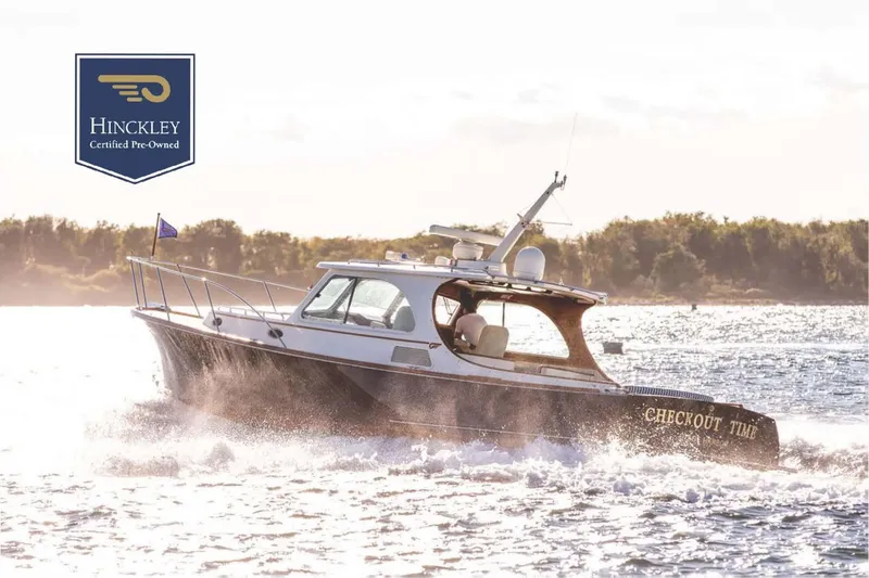 Slide: The Image of 2007 Hinckley Talaria 40 yacht cruising on water, certified pre-owned. - 33