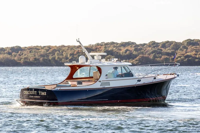 Slide: The Image of 2007 Hinckley Talaria 40 yacht cruising on scenic waterway. - 4