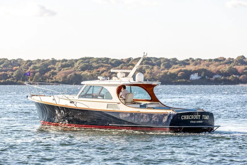 Slide: The Image of 2007 Hinckley Talaria 40 yacht cruising on scenic waterway. - 7