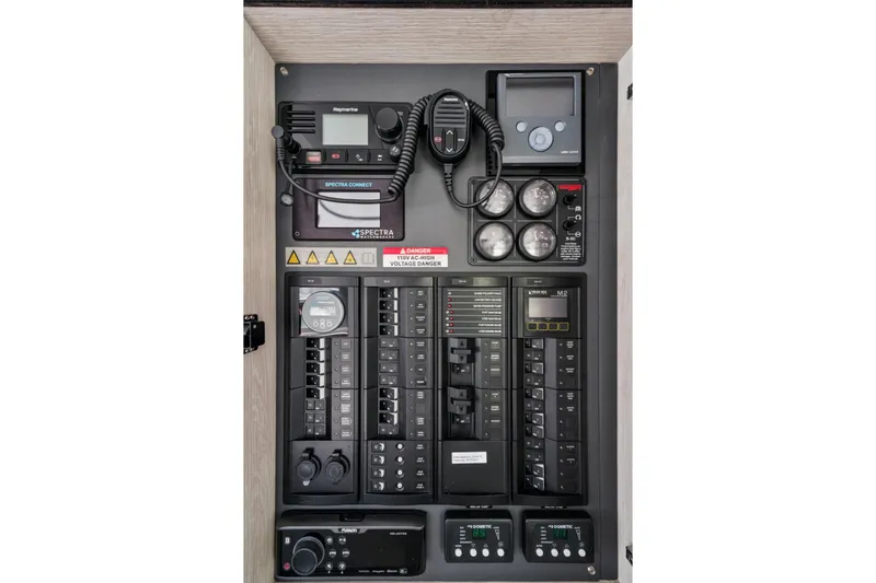 Slide: The Image of Electrical control panel of a 2021 Leopard 45 yacht, featuring various switches and gauges. - 106