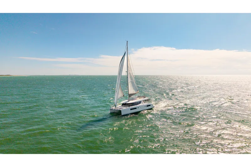 Slide: The Image of Sailing Leopard 45 catamaran on open sea under clear blue sky, 2021 model. - 109