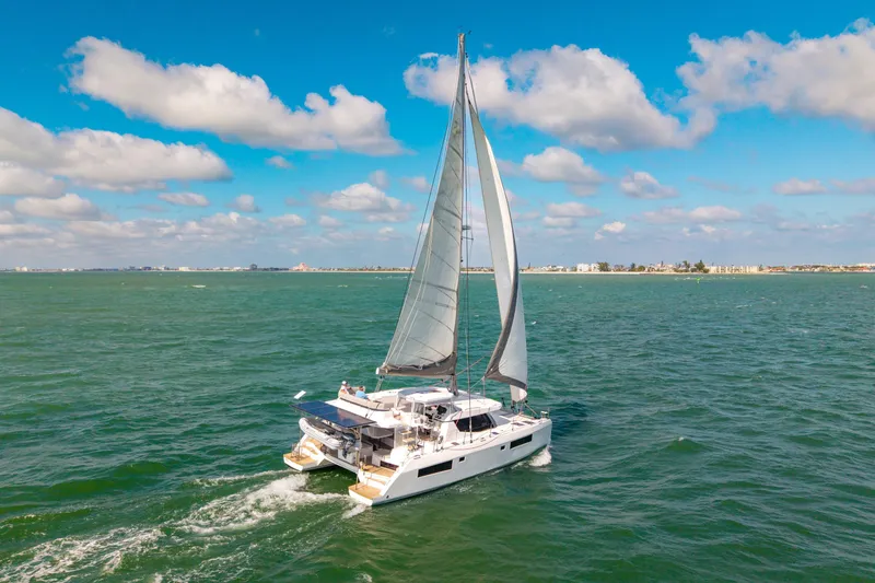 Slide: The Image of Sailing Leopard 45 catamaran on open sea, 2021 model, under clear blue sky. - 112