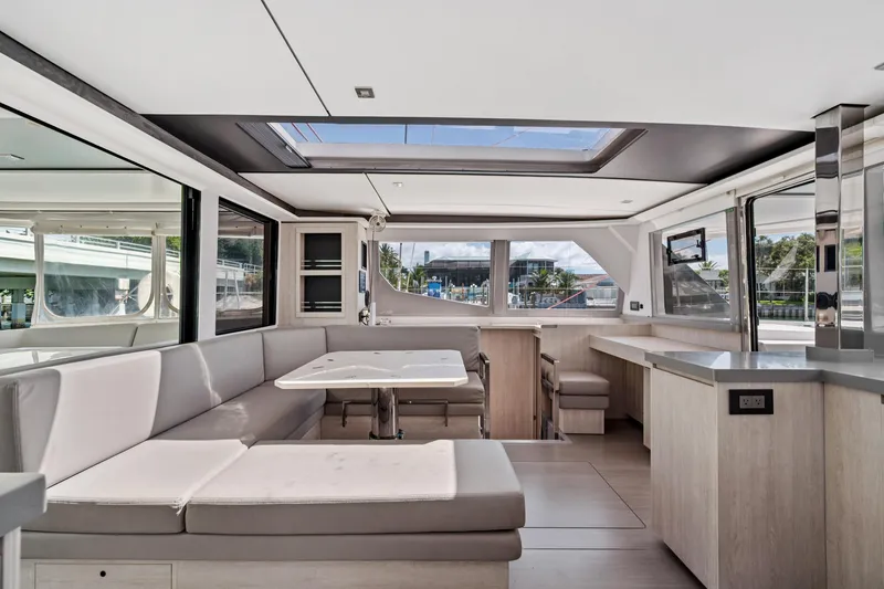 Slide: The Image of Luxurious interior of 2021 Leopard 45 catamaran with modern seating and panoramic windows. - 40