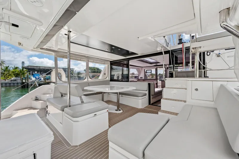 Slide: The Image of Spacious interior of 2021 Leopard 45 catamaran with modern seating and dining area. - 46