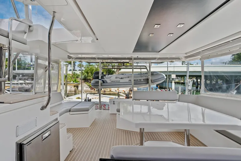 Slide: The Image of Luxurious 2021 Leopard 45 yacht interior with modern seating and dining area. - 49