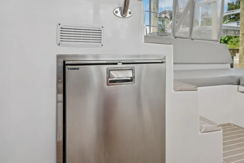 Slide: The Image of Stainless steel fridge on 2021 Leopard 45 yacht, near seating area. - 51