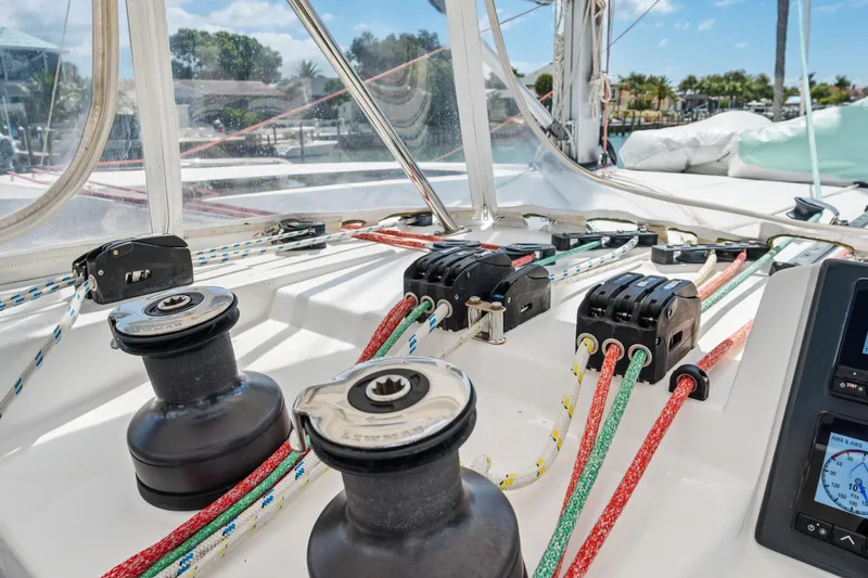 Slide: The Image of Sailing equipment on a 2021 Leopard 45 catamaran, featuring winches and colorful ropes. - 57