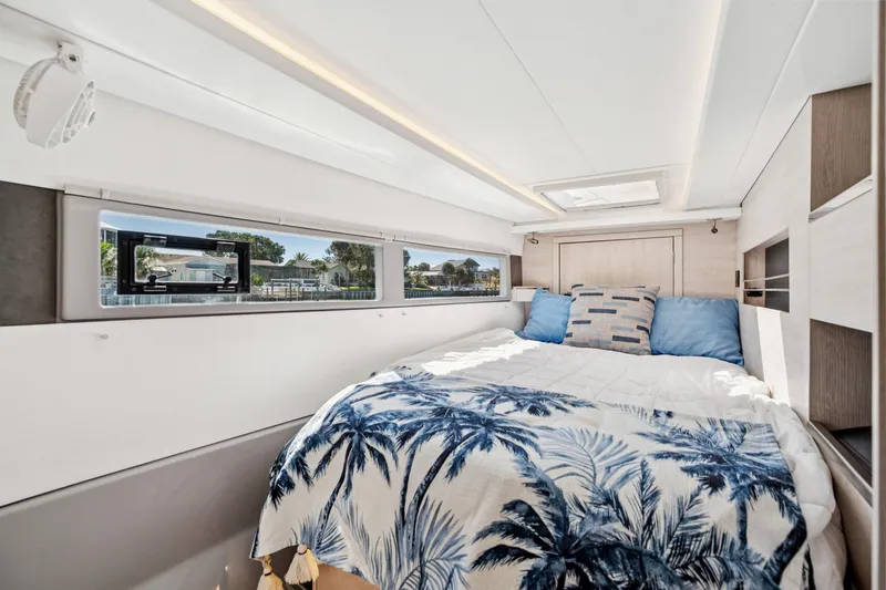 Slide: The Image of Luxurious bedroom interior of 2021 Leopard 45 yacht with scenic window views. - 62