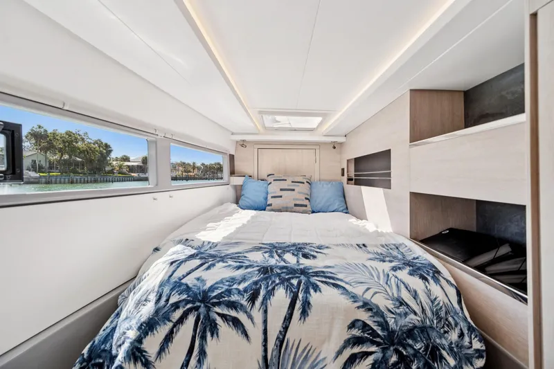Slide: The Image of Luxurious 2021 Leopard 45 yacht bedroom with scenic window view. - 63