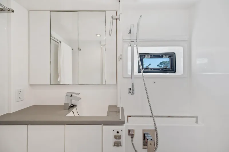 Slide: The Image of Modern bathroom interior of 2021 Leopard 45 yacht with sleek fixtures and window view. - 66