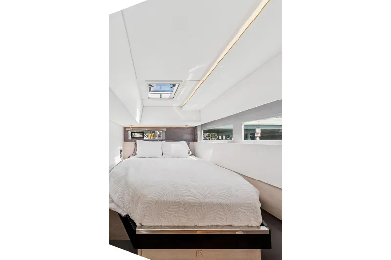 Slide: The Image of Luxurious bedroom interior of 2021 Leopard 45 yacht with skylight and modern design. - 69