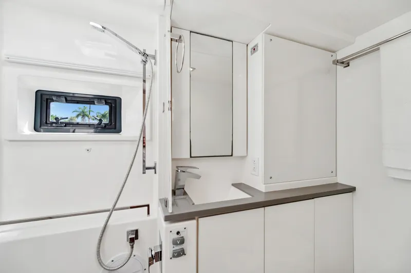 Slide: The Image of Modern bathroom interior of 2021 Leopard 45 yacht with sleek fixtures and window view. - 72