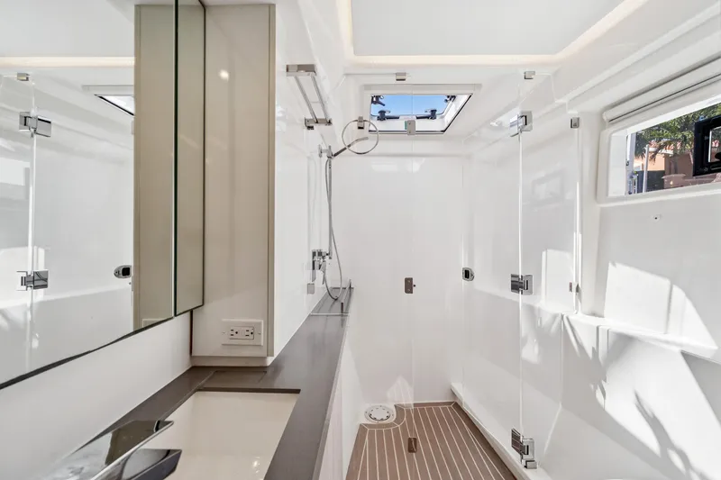 Slide: The Image of Modern bathroom interior on 2021 Leopard 45 yacht, featuring sleek design and natural light. - 77