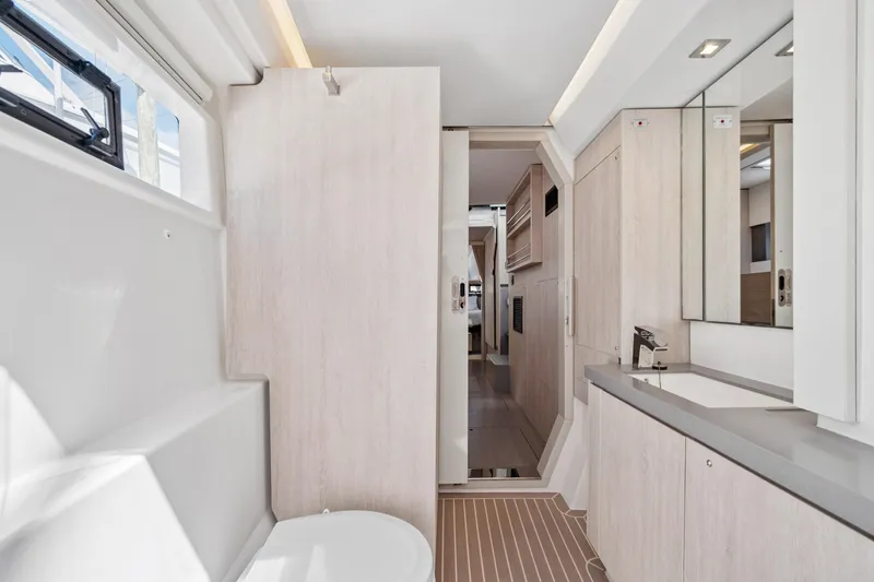 Slide: The Image of Modern bathroom interior of 2021 Leopard 45 yacht, featuring sleek design and ample natural light. - 79