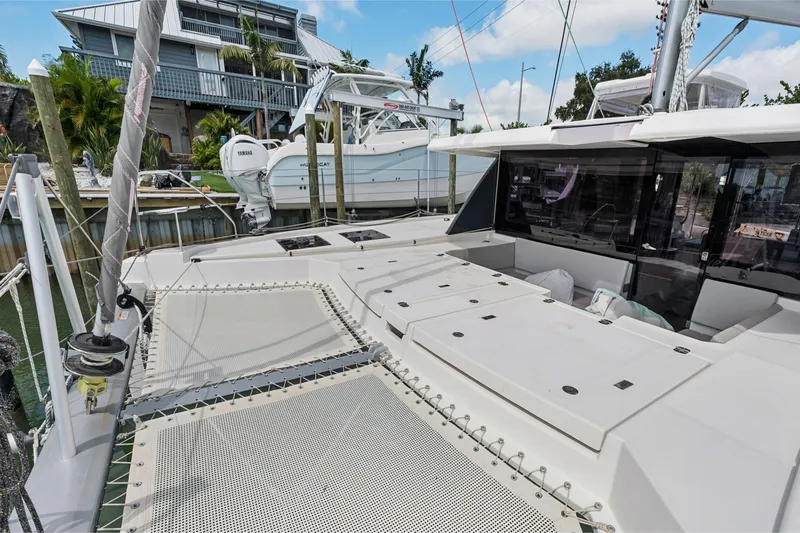 Slide: The Image of 2021 Leopard 45 catamaran docked, showcasing spacious deck and modern design. - 8