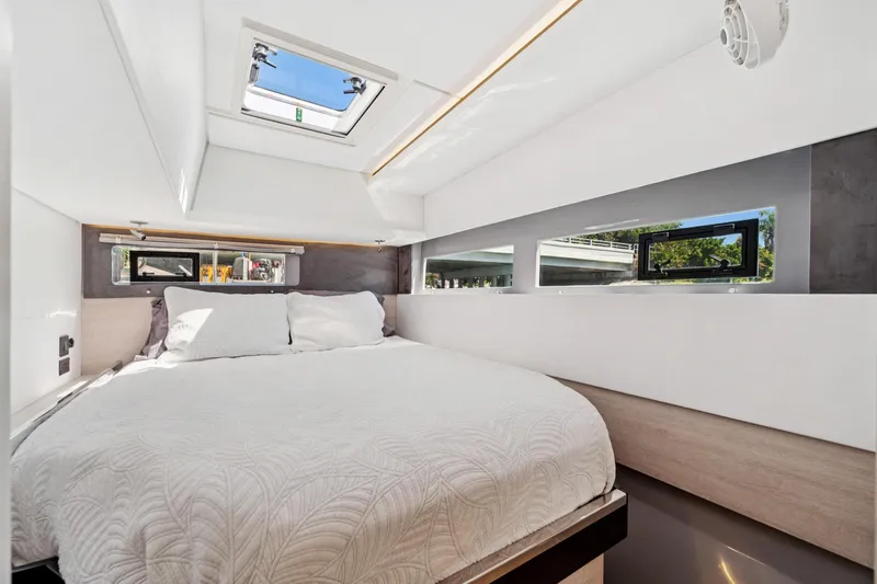 Slide: The Image of Luxurious bedroom interior of 2021 Leopard 45 yacht with modern design and natural light. - 87