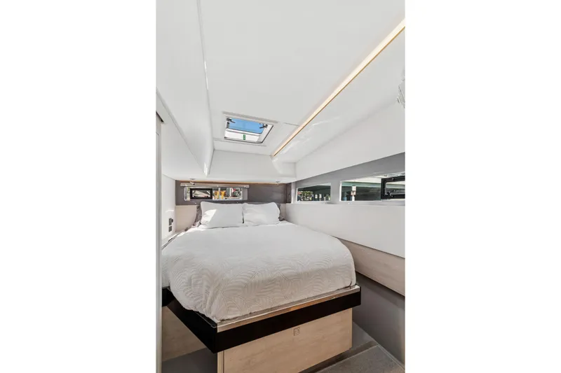 Slide: The Image of Luxurious bedroom interior of 2021 Leopard 45 yacht with skylight and modern design. - 89