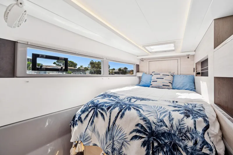 Slide: The Image of Luxurious bedroom interior of 2021 Leopard 45 yacht with scenic window view. - 90