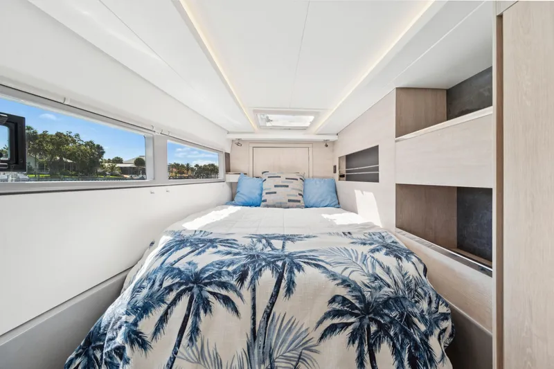 Slide: The Image of Luxurious 2021 Leopard 45 yacht bedroom with palm-themed bedding and modern design. - 91
