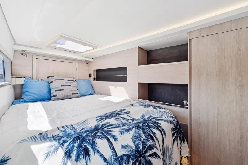 Slide: The Image of Luxurious bedroom interior of 2021 Leopard 45 yacht with modern design and tropical bedding. - 92
