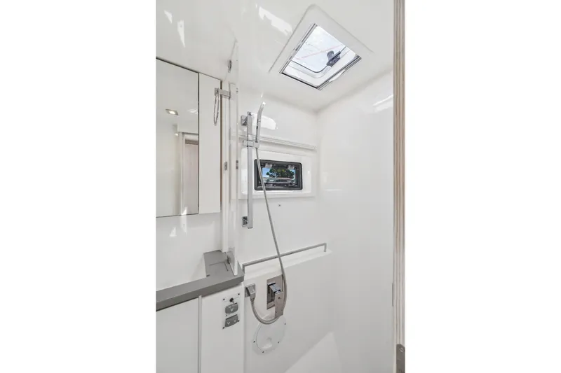 Slide: The Image of Modern bathroom interior in 2021 Leopard 45 yacht, featuring sleek design and skylight. - 95