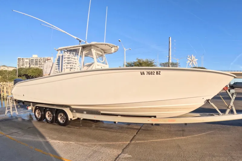 Slide: The Image of 2007 Cape Horn 36T boat on trailer, parked outdoors under clear sky. - 12