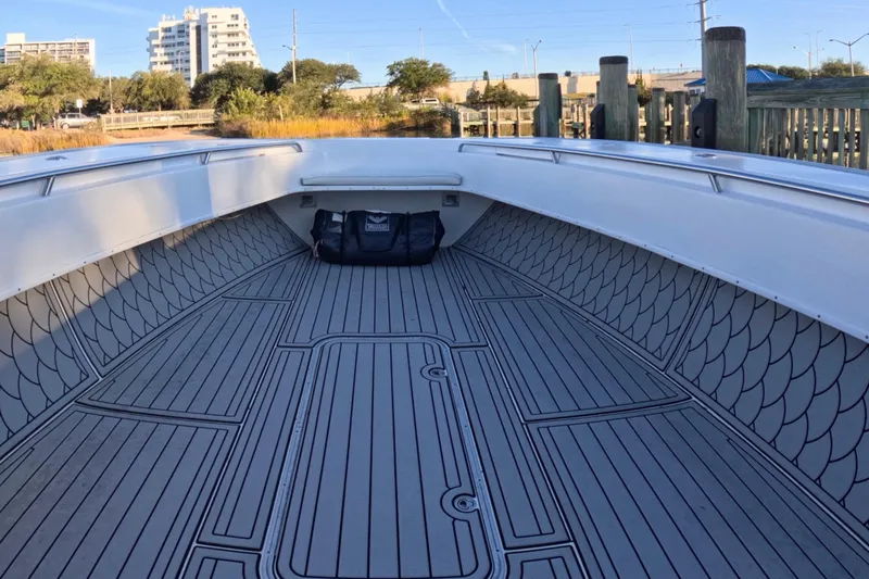 Slide: The Image of 2007 Cape Horn 36T boat interior with patterned flooring, docked near urban buildings. - 6