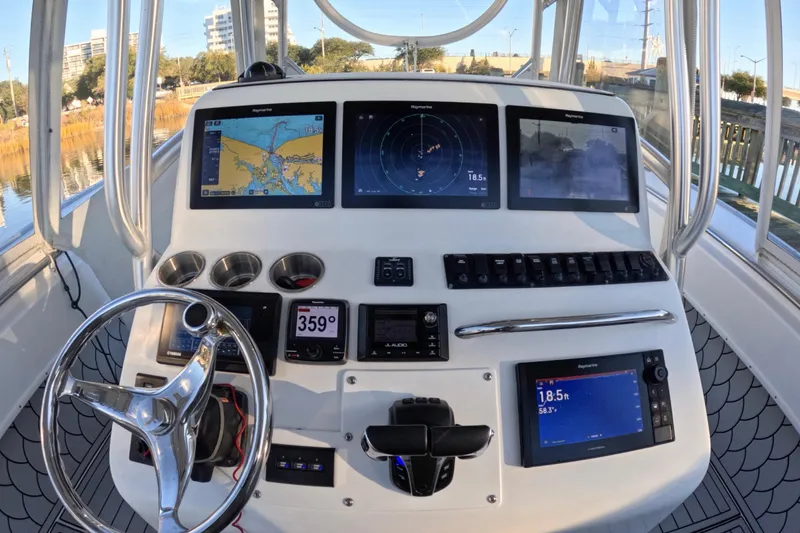 Slide: The Image of 2007 Cape Horn 36T boat dashboard with navigation screens and controls. - 4