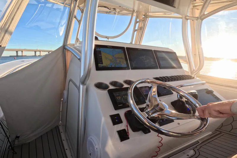 Slide: The Image of Helm of 2007 Cape Horn 36T boat with navigation screens and steering wheel. - 5