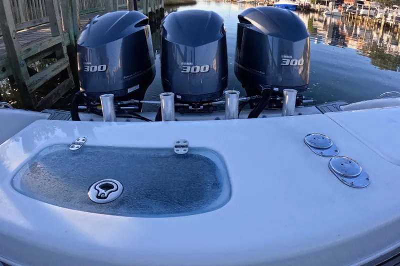 Slide: The Image of 2007 Cape Horn 36T boat with triple Yamaha 300 engines docked by the water. - 7