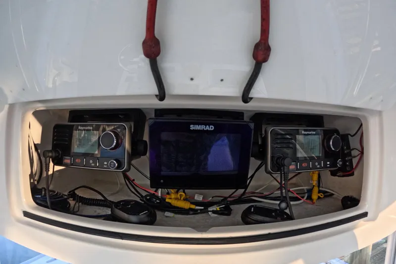 Slide: The Image of Electronics panel on a 2007 Cape Horn 36T boat with Raymarine and Simrad devices. - 9