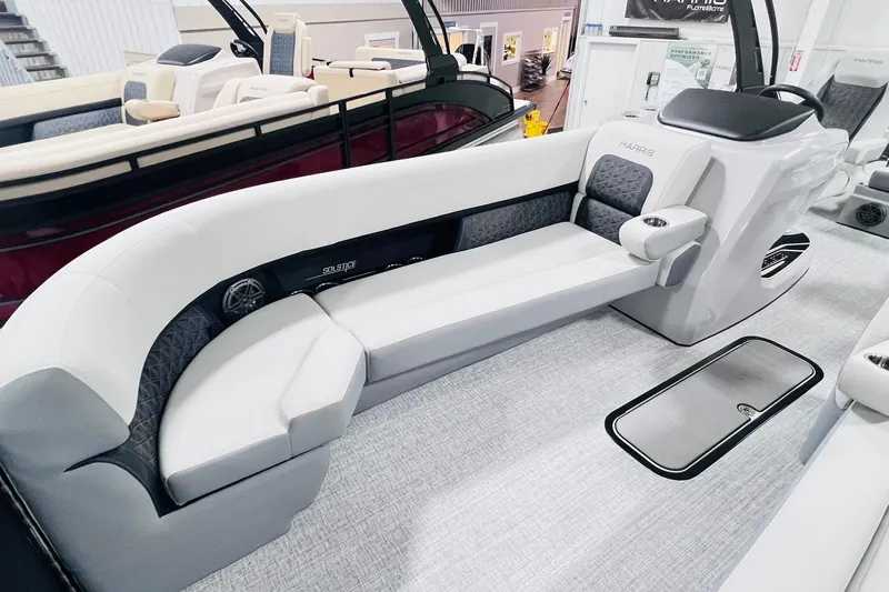 Slide: The Image of 2025 Harris Solstice 250 boat interior with luxurious seating and modern design. - 10