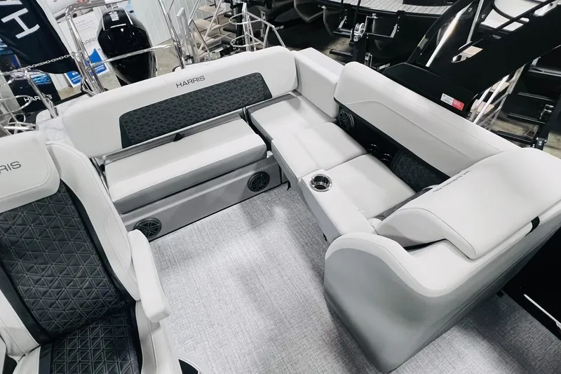 Slide: The Image of 2025 Harris Solstice 250 boat interior with luxurious seating and modern design. - 13