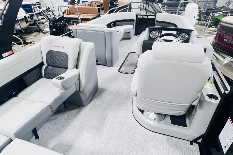 Slide: The Image of 2025 Harris Solstice 250 boat interior with luxurious seating and modern dashboard. - 15