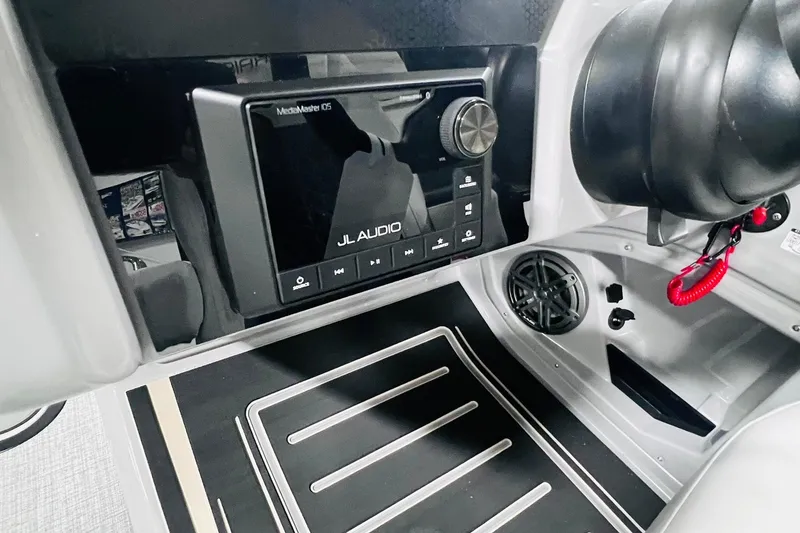 Slide: The Image of 2025 Harris Solstice 250 dashboard featuring JL Audio system and sleek interior design. - 25