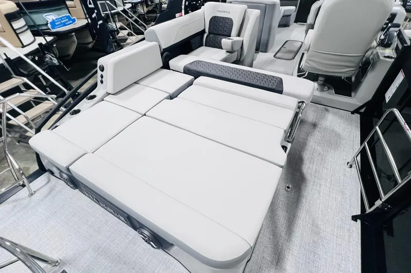 Slide: The Image of 2025 Harris Solstice 250 boat interior with luxurious seating and modern design. - 30