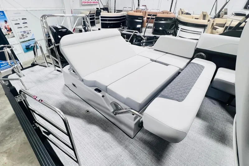 Slide: The Image of 2025 Harris Solstice 250 boat interior with luxurious seating and modern design. - 32