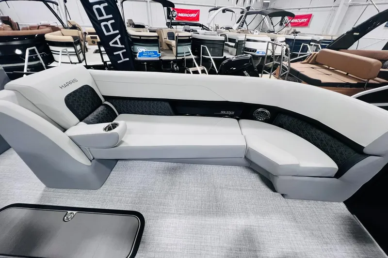 Slide: The Image of 2025 Harris Solstice 250 boat interior with luxurious seating and modern design. - 34