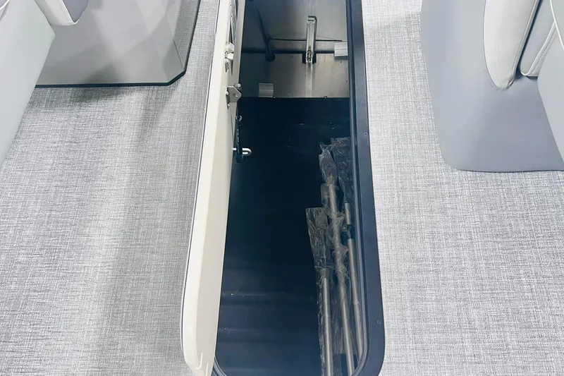 Slide: The Image of 2025 Harris Solstice 250 boat storage compartment with gray interior and seating. - 46