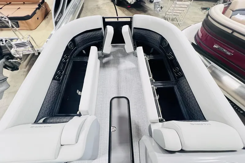 Slide: The Image of 2025 Harris Solstice 250 boat interior with luxurious seating and modern design. - 49