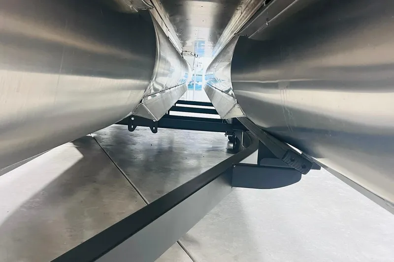 Slide: The Image of Underneath view of 2025 Harris Solstice 250 pontoon boat, showcasing sleek aluminum pontoons. - 56