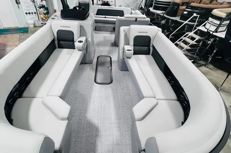 Slide: The Image of 2025 Harris Solstice 250 boat interior with spacious seating and modern design. - 8
