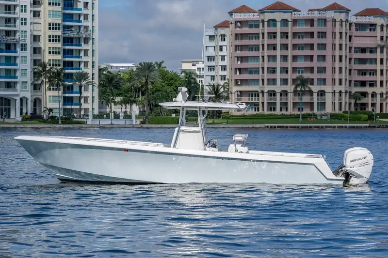 The Image of 2013 Contender 35 ST boat on water with cityscape background. - 0