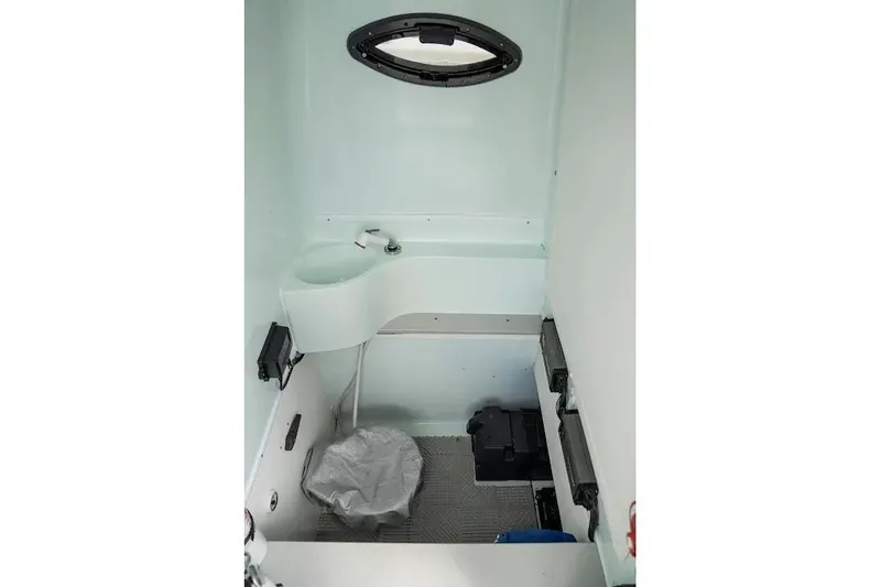 Slide: The Image of 2013 Contender 35 ST boat interior with compact sink and toilet. - 12