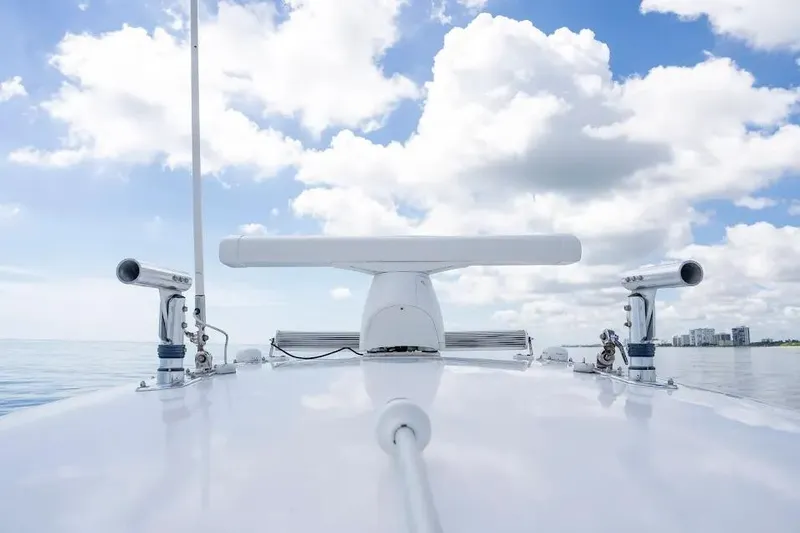 Slide: The Image of 2013 Contender 35 ST boat radar system under a bright blue sky with clouds. - 17