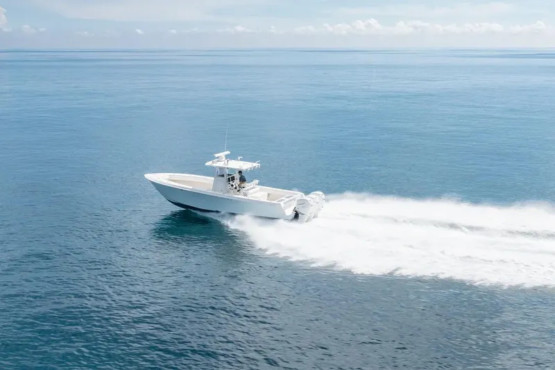 Slide: The Image of 2013 Contender 35 ST boat speeding on open ocean waters. - 21
