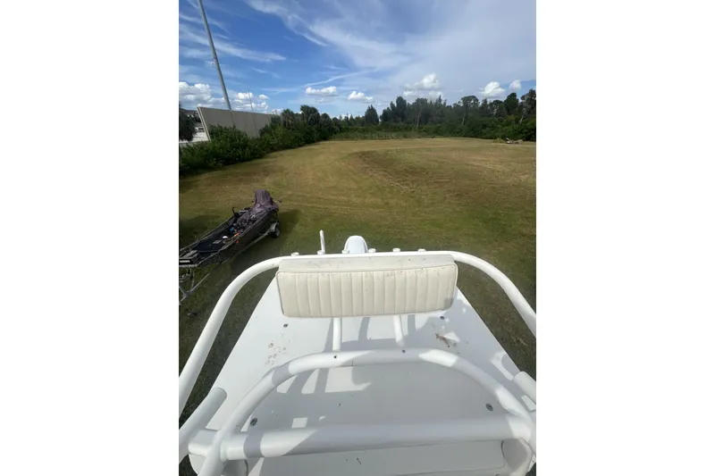 Slide: The Image of 2021 Panga Captiva boat on grassy field under blue sky. - 13