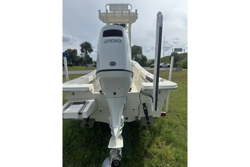 Slide: The Image of 2021 Panga Captiva boat with 200 horsepower engine, rear view on grass. - 4