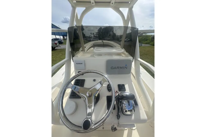 Slide: The Image of 2021 Panga Captiva boat console with Garmin and Suzuki controls. - 8